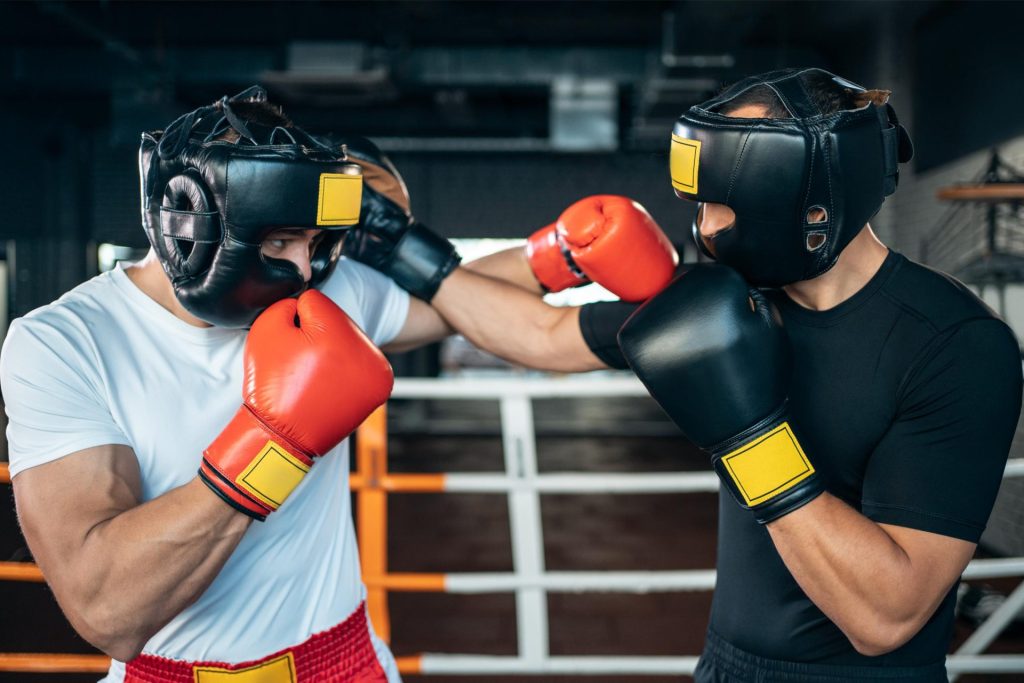 2 men playing against each other during a boxing match