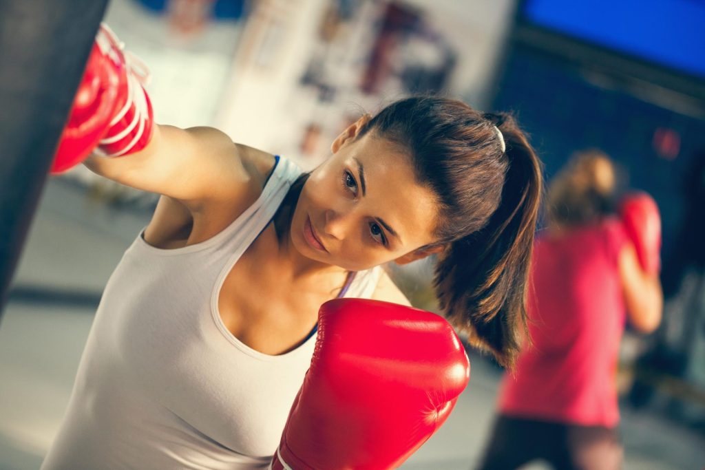 Girl playing boxing at the gym